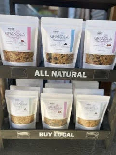 Mary's All Natural granola pouches on a Buy Local store display.